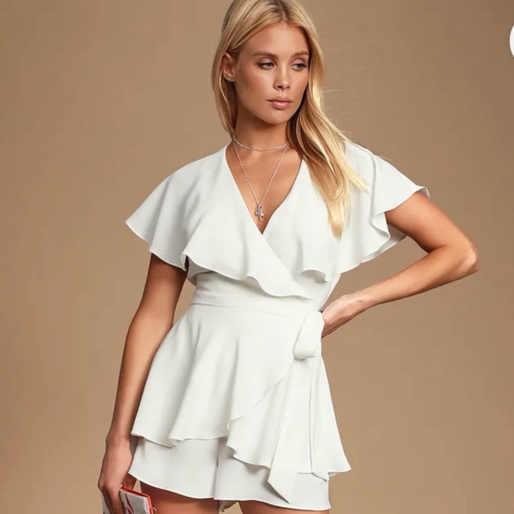 White romper. Size small. Never worn & tags still on.